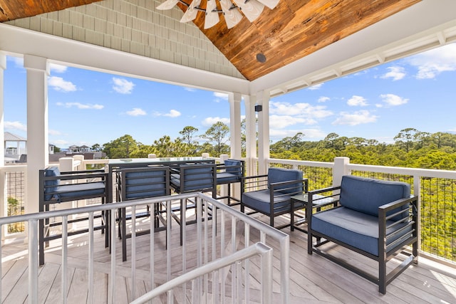 wooden terrace featuring a ceiling fan