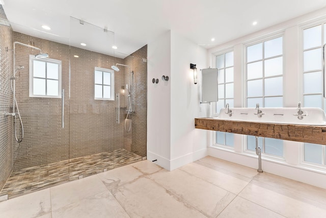 full bath featuring a walk in shower, baseboards, and recessed lighting