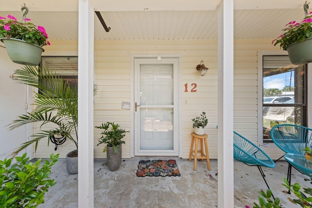 doorway to property featuring a porch