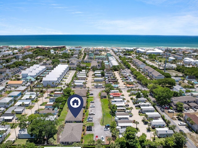 aerial view of residential area featuring a large body of water