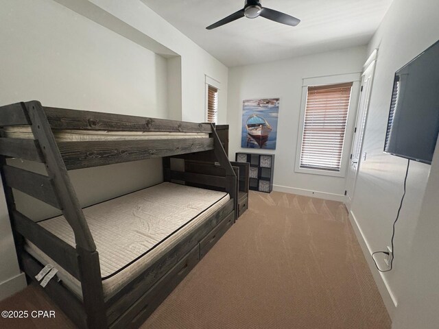 5303 Hopetown Ln, Panama City Beach, FL 32408 - bedroom with baseboards, light colored carpet, and ceiling fan