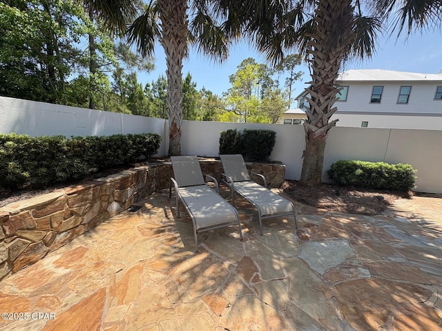 5303 Hopetown Ln, Panama City Beach, FL 32408 - view of patio / terrace with a fenced backyard