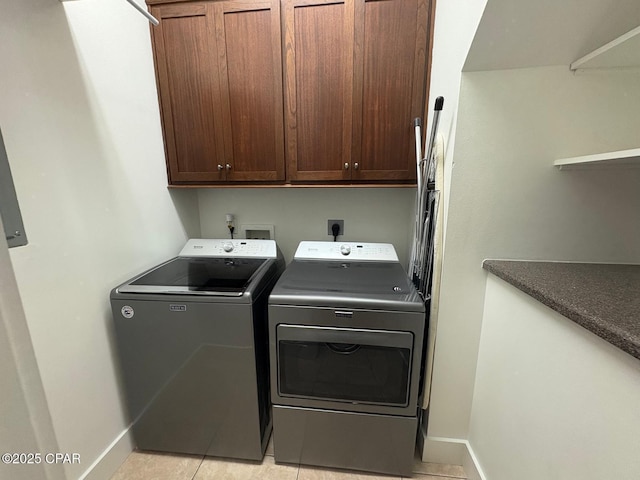 5303 Hopetown Ln, Panama City Beach, FL 32408 - clothes washing area featuring cabinet space, washing machine and clothes dryer, baseboards, and light tile patterned flooring