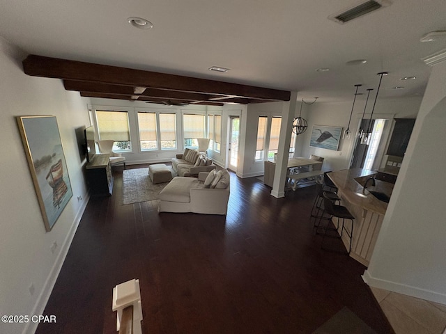 5303 Hopetown Ln, Panama City Beach, FL 32408 - living room featuring baseboards, beamed ceiling, dark wood finished floors, and recessed lighting