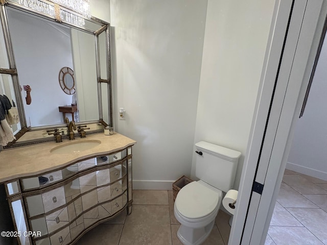 5303 Hopetown Ln, Panama City Beach, FL 32408 - half bathroom featuring tile patterned floors, toilet, vanity, and baseboards