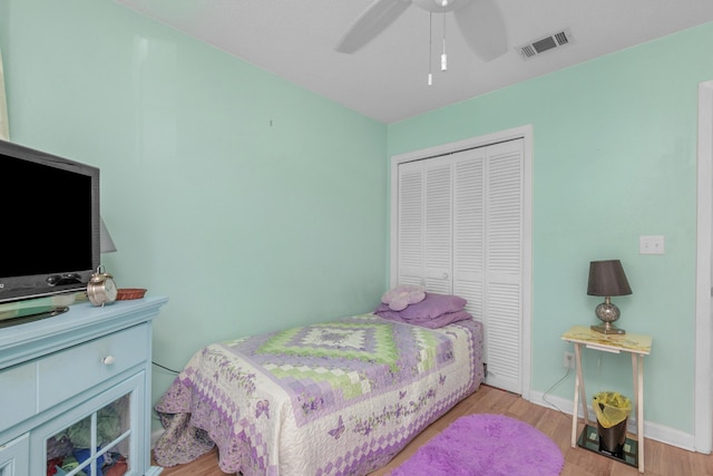 102 Wright Dr, Niceville, FL 32578 - bedroom with a closet, wood finished floors, baseboards, and a ceiling fan