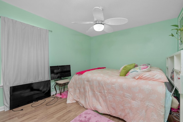 102 Wright Dr, Niceville, FL 32578 - bedroom with wood finished floors, ceiling fan, and baseboards