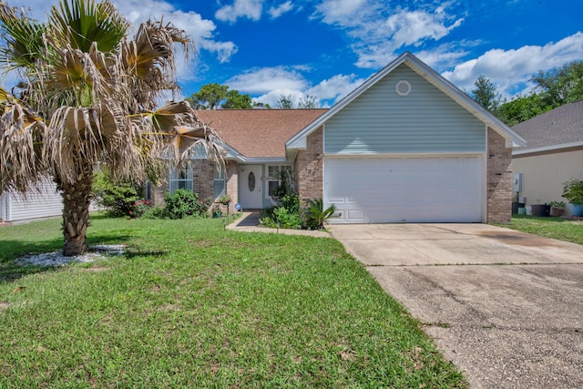 102 Wright Dr, Niceville, FL 32578 - view of front of home featuring brick siding, concrete driveway, a front yard, an attached garage, and a shingled roof