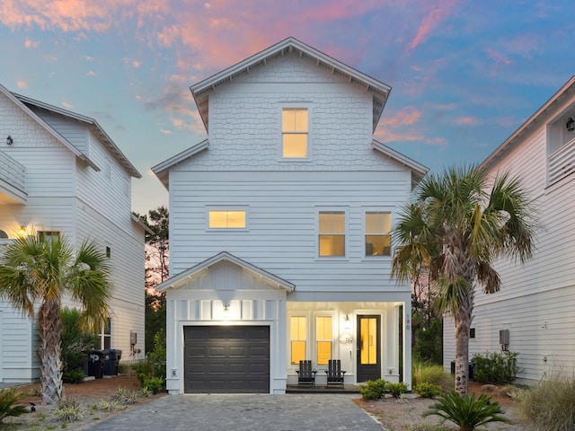 190 Valdare Ln, Inlet Beach, FL 32461 - view of front of home with board and batten siding, decorative driveway, and a garage