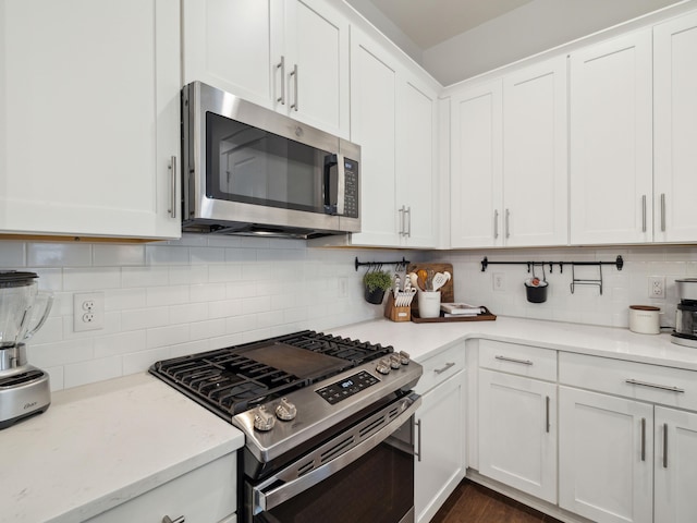 190 Valdare Ln, Inlet Beach, FL 32461 - kitchen with appliances with stainless steel finishes, tasteful backsplash, white cabinets, and light stone counters