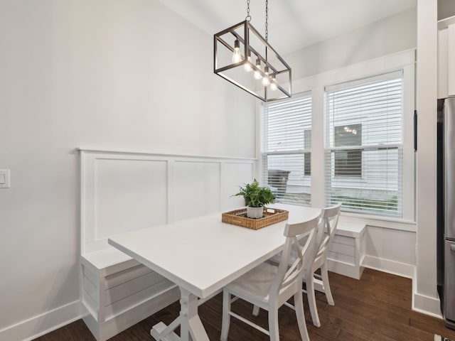 190 Valdare Ln, Inlet Beach, FL 32461 - dining room featuring a chandelier, baseboards, dark wood finished floors, and a wainscoted wall