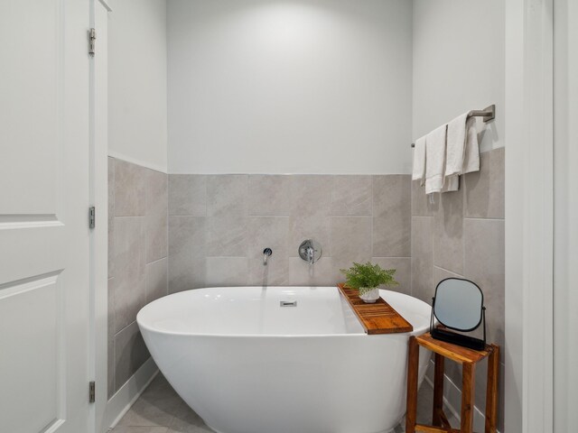 190 Valdare Ln, Inlet Beach, FL 32461 - full bath with tile walls, a freestanding tub, and a wainscoted wall