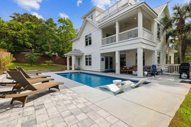 241 Overlook Dr, Miramar Beach, FL 32550 - view of swimming pool featuring ceiling fan, fence, a patio, and french doors