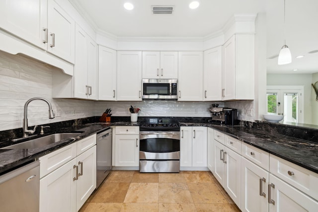 241 Overlook Dr, Miramar Beach, FL 32550 - kitchen with stainless steel appliances, a sink, white cabinetry, and recessed lighting