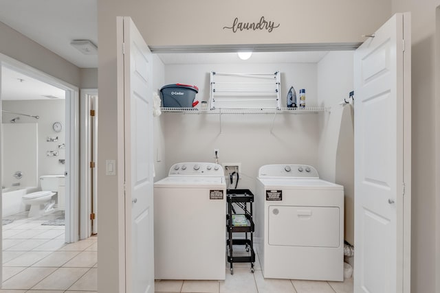 4274 Calinda Ln Unit 225, Niceville, FL 32578 - laundry area featuring washer and clothes dryer and light tile patterned floors