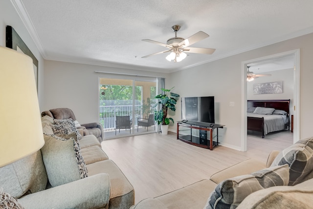 4274 Calinda Ln Unit 225, Niceville, FL 32578 - living room with ceiling fan, ornamental molding, wood finished floors, and a textured ceiling