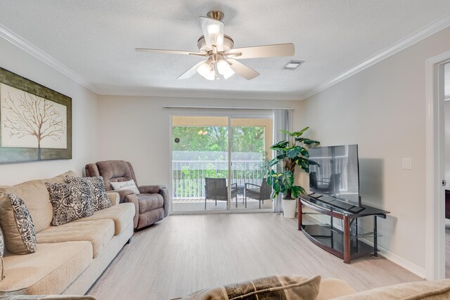 4274 Calinda Ln Unit 225, Niceville, FL 32578 - living room with wood finished floors, ceiling fan, crown molding, and a textured ceiling