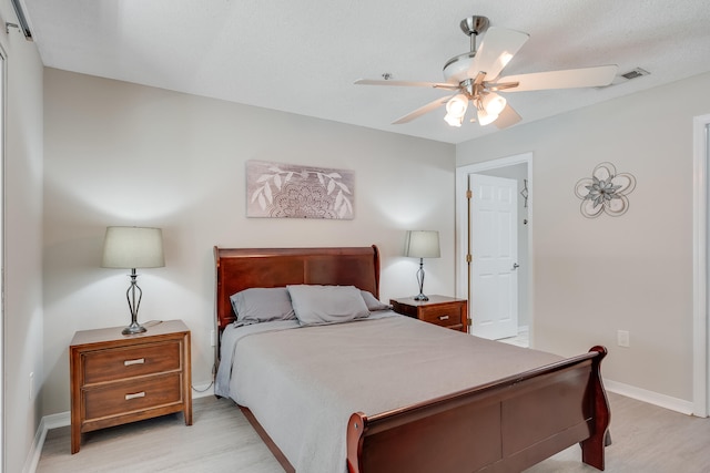 4274 Calinda Ln Unit 225, Niceville, FL 32578 - bedroom featuring light wood-style floors, a ceiling fan, and baseboards