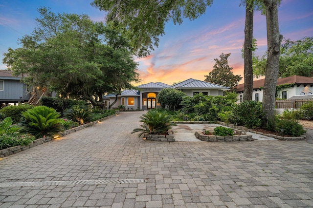 411 Calhoun Ave, Destin, FL 32541 - view of front of home featuring a standing seam roof, decorative driveway, metal roof, and stucco siding