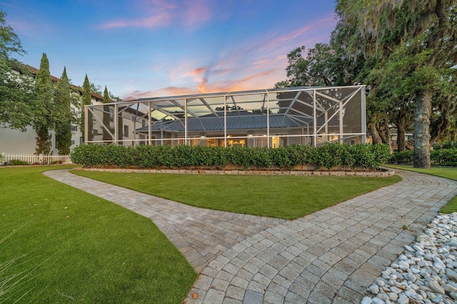 411 Calhoun Ave, Destin, FL 32541 - yard at dusk with a lanai