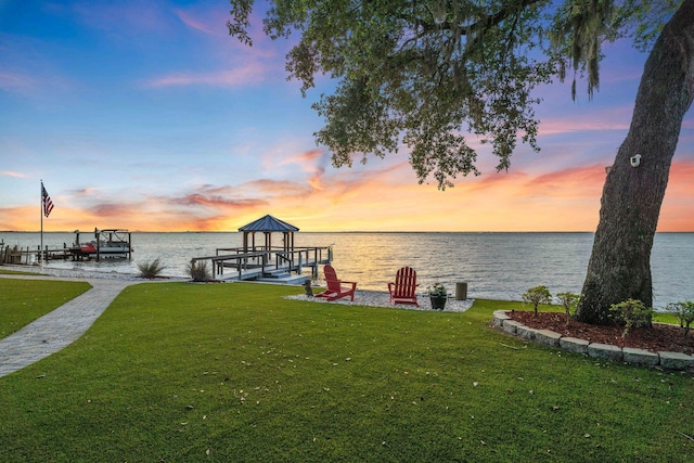 411 Calhoun Ave, Destin, FL 32541 - dock with boat lift, a yard, and a water view