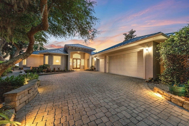 411 Calhoun Ave, Destin, FL 32541 - mediterranean / spanish house with a standing seam roof, stucco siding, and metal roof