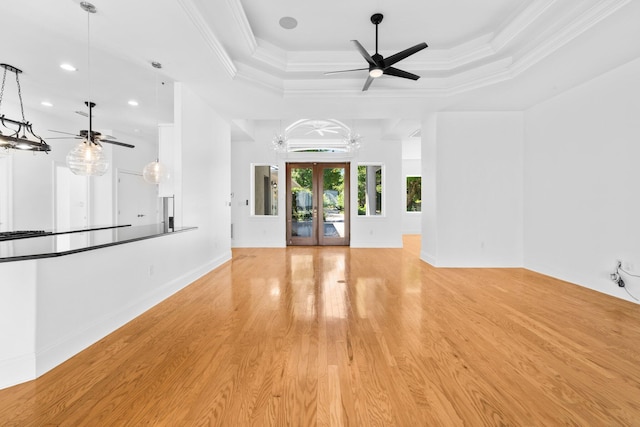 411 Calhoun Ave, Destin, FL 32541 - unfurnished living room featuring ceiling fan, a tray ceiling, recessed lighting, light wood-style flooring, and baseboards
