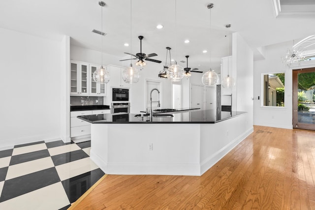 411 Calhoun Ave, Destin, FL 32541 - kitchen featuring a sink, dark countertops, white cabinetry, recessed lighting, and a ceiling fan