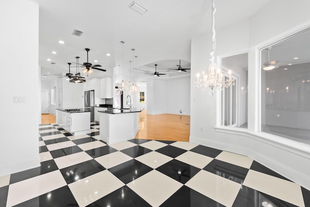 411 Calhoun Ave, Destin, FL 32541 - unfurnished living room with a chandelier, a ceiling fan, recessed lighting, a sink, and baseboards