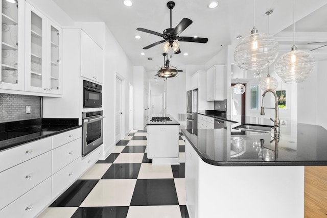 411 Calhoun Ave, Destin, FL 32541 - kitchen featuring a center island, a sink, recessed lighting, tile patterned floors, and backsplash