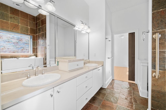 411 Calhoun Ave, Destin, FL 32541 - bathroom featuring stone tile floors and double vanity