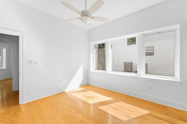 411 Calhoun Ave, Destin, FL 32541 - empty room featuring light wood finished floors, a ceiling fan, and baseboards