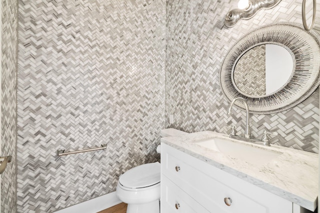 411 Calhoun Ave, Destin, FL 32541 - bathroom with tile walls, vanity, and toilet