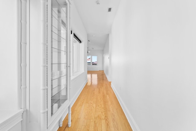 411 Calhoun Ave, Destin, FL 32541 - corridor with light wood-type flooring and baseboards