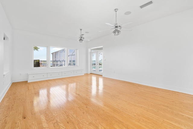 411 Calhoun Ave, Destin, FL 32541 - unfurnished living room featuring french doors, light wood-style floors, ceiling fan, and baseboards
