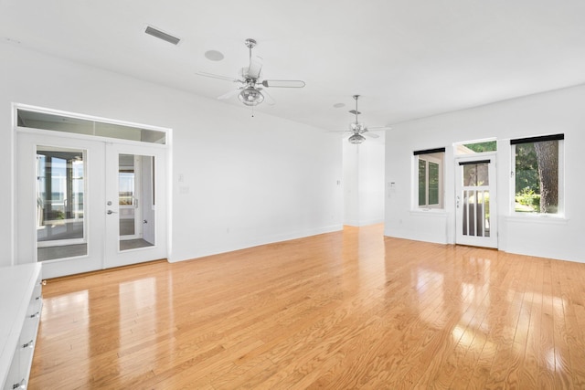 411 Calhoun Ave, Destin, FL 32541 - unfurnished living room featuring ceiling fan, french doors, and light wood-style floors