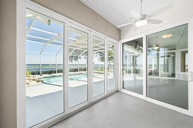 411 Calhoun Ave, Destin, FL 32541 - unfurnished sunroom featuring a ceiling fan and a water view