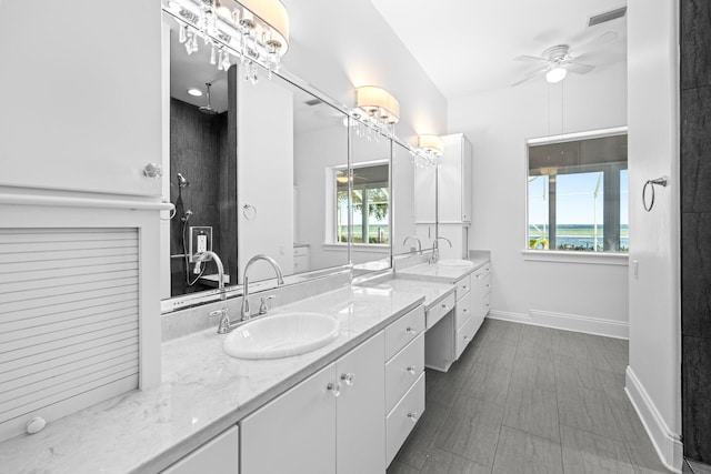411 Calhoun Ave, Destin, FL 32541 - full bathroom with ceiling fan, double vanity, baseboards, and a shower