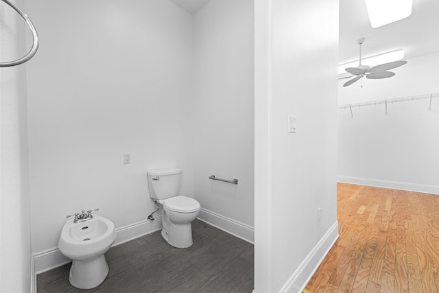 411 Calhoun Ave, Destin, FL 32541 - bathroom with wood finished floors, a bidet, toilet, and a walk in closet