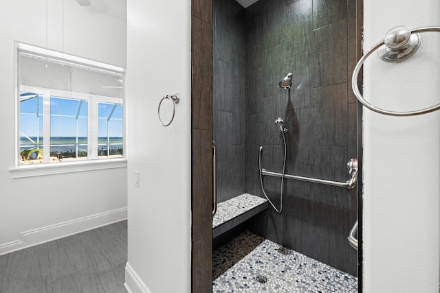 411 Calhoun Ave, Destin, FL 32541 - full bath featuring tiled shower, baseboards, and a water view