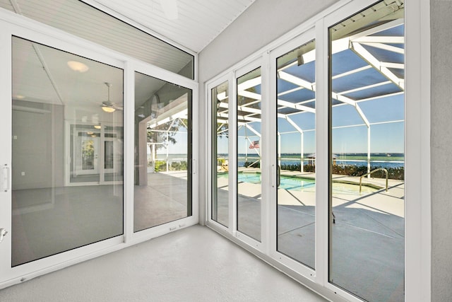 411 Calhoun Ave, Destin, FL 32541 - unfurnished sunroom featuring a water view and ceiling fan