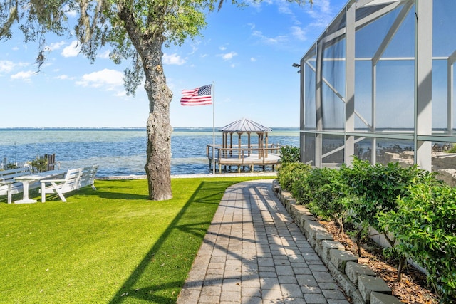 411 Calhoun Ave, Destin, FL 32541 - view of green lawn featuring a water view and a lanai