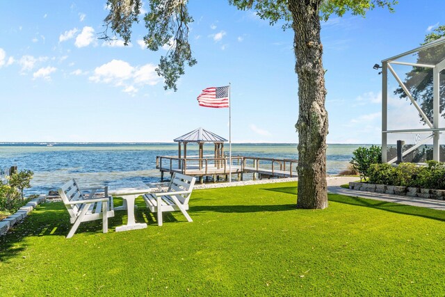 411 Calhoun Ave, Destin, FL 32541 - dock with a lawn, a water view, and a lanai