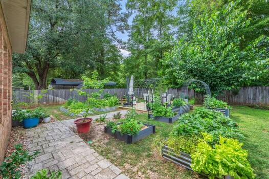 5930 Wind Trace Rd, Crestview, FL 32536 - fenced backyard with a garden