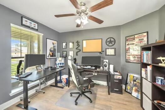 5930 Wind Trace Rd, Crestview, FL 32536 - office area with a ceiling fan, baseboards, and wood finished floors