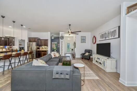 5930 Wind Trace Rd, Crestview, FL 32536 - living area with a ceiling fan and light wood-type flooring