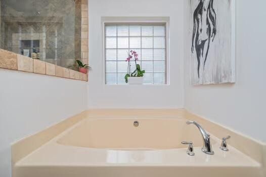 5930 Wind Trace Rd, Crestview, FL 32536 - full bath featuring a bath and a tile shower