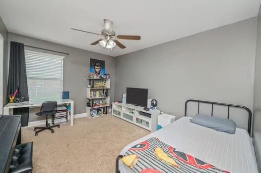 5930 Wind Trace Rd, Crestview, FL 32536 - carpeted bedroom with an office area, baseboards, and ceiling fan