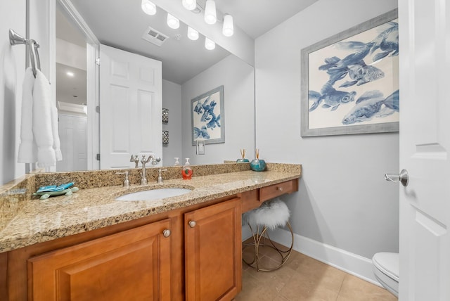 1653 W County Highway 30a Unit 1109, Santa Rosa Beach, FL 32459 - bathroom featuring baseboards, vanity, toilet, and tile patterned floors