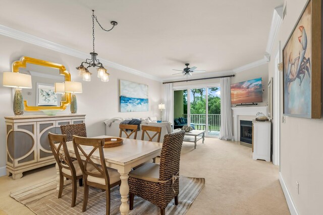1653 W County Highway 30a Unit 1109, Santa Rosa Beach, FL 32459 - dining space with crown molding, light colored carpet, a fireplace, ceiling fan, and baseboards